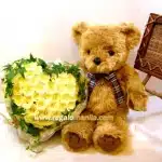 Teddy bear with yellow roses