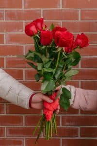 Couple exchanging romantic gifts with personalized touches