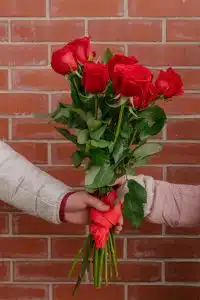 Couple exchanging romantic gifts with personalized touches