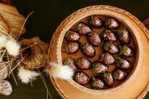 Romantic chocolate truffle box paired with a personalized rose bouquet.